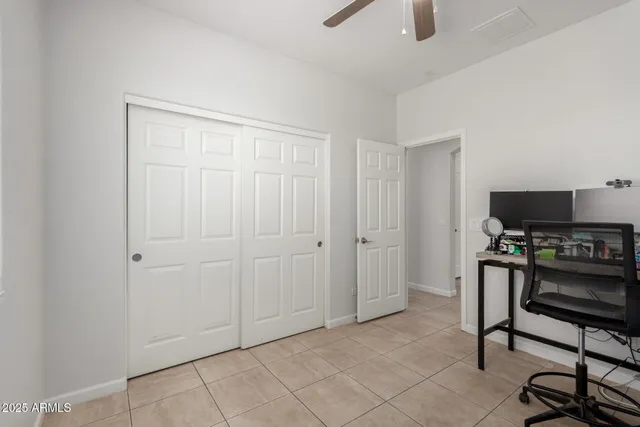 a view of a workspace with furniture