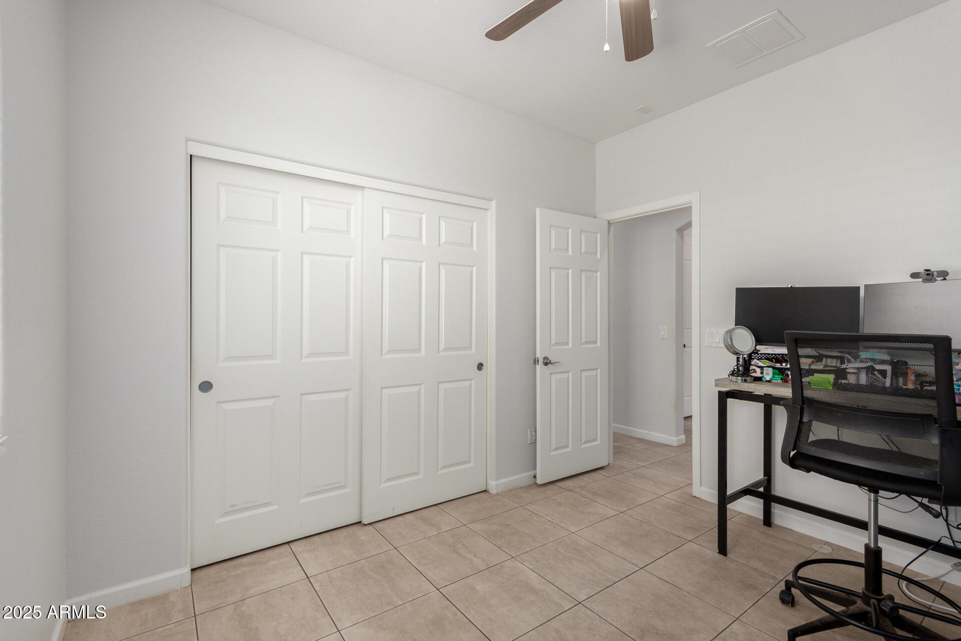 2413 West Beverly Rd. Phoenix, AZ 85041 - Photo 22 of 28 a view of a workspace with furniture