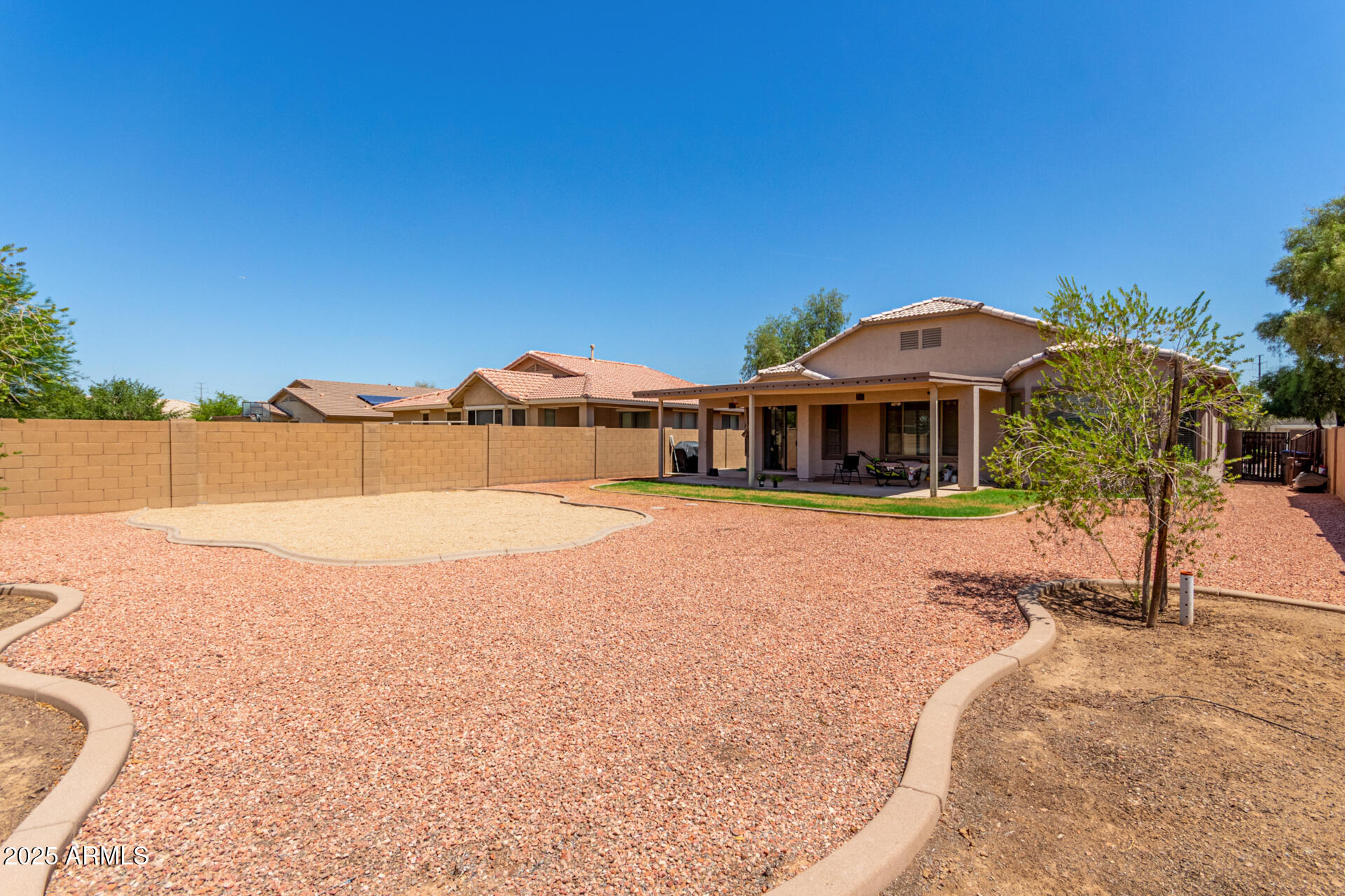 2413 West Beverly Rd. Phoenix, AZ 85041 - Photo 26 of 28 a front view of a house with a yard