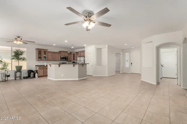 a view of a livingroom with furniture and a kitchen
