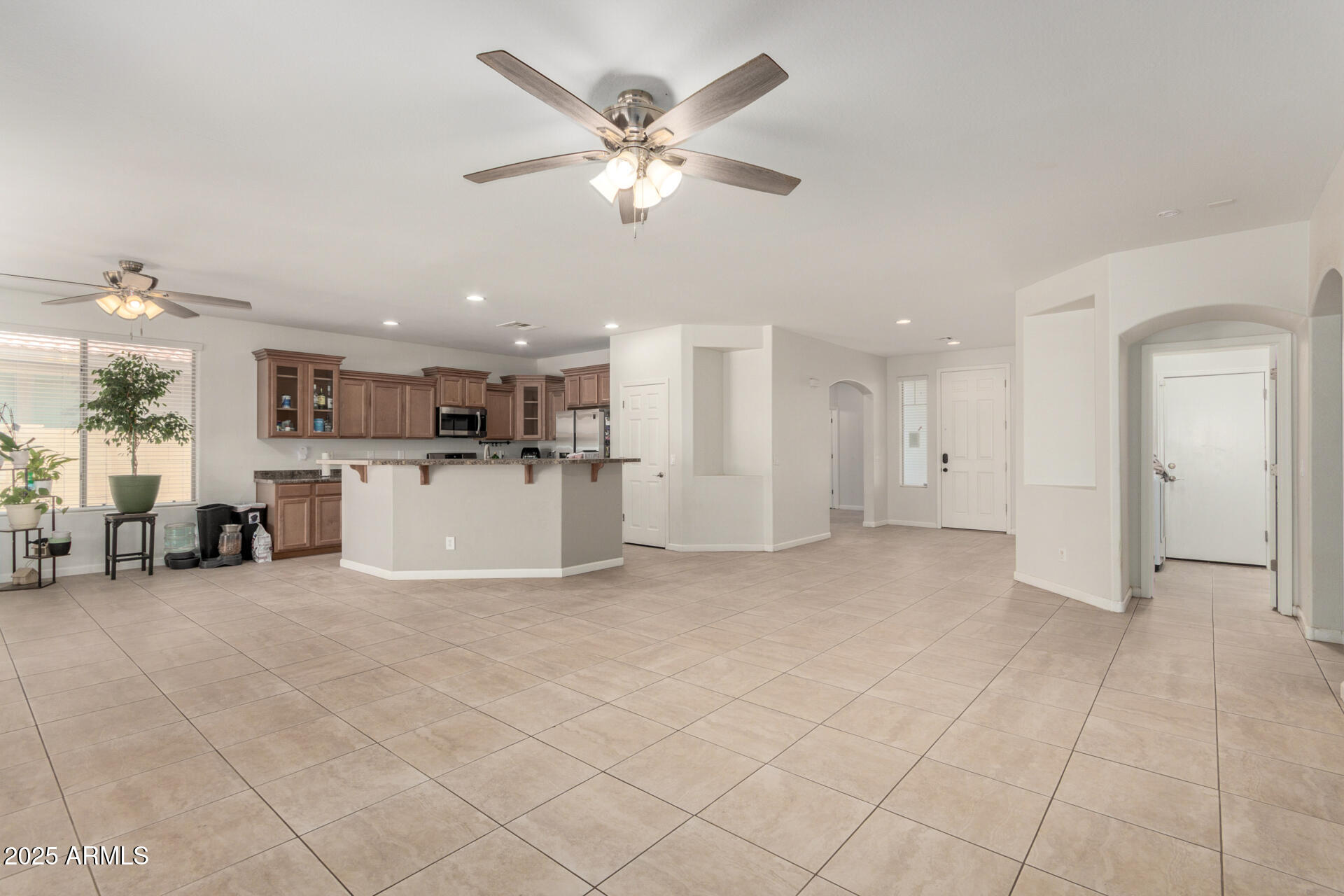 2413 West Beverly Rd. Phoenix, AZ 85041 - Photo 10 of 28 a view of a livingroom with furniture and a kitchen