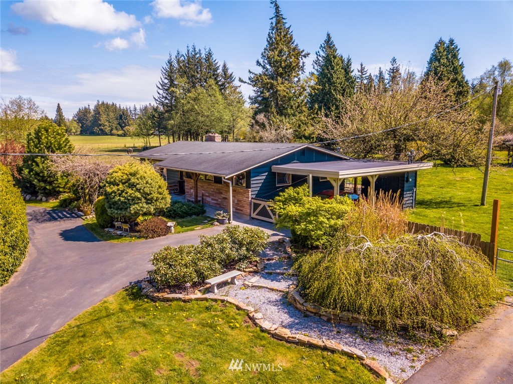 3879 Brown Road Ferndale, WA 98248 - Photo 1 of 36 a front view of a house with a yard