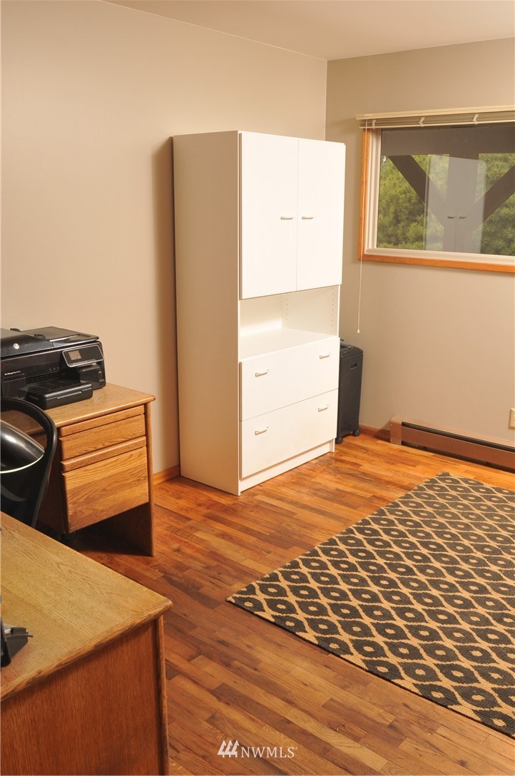 3879 Brown Road Ferndale, WA 98248 - Photo 14 of 36 a view of a bedroom with wooden floor and a window