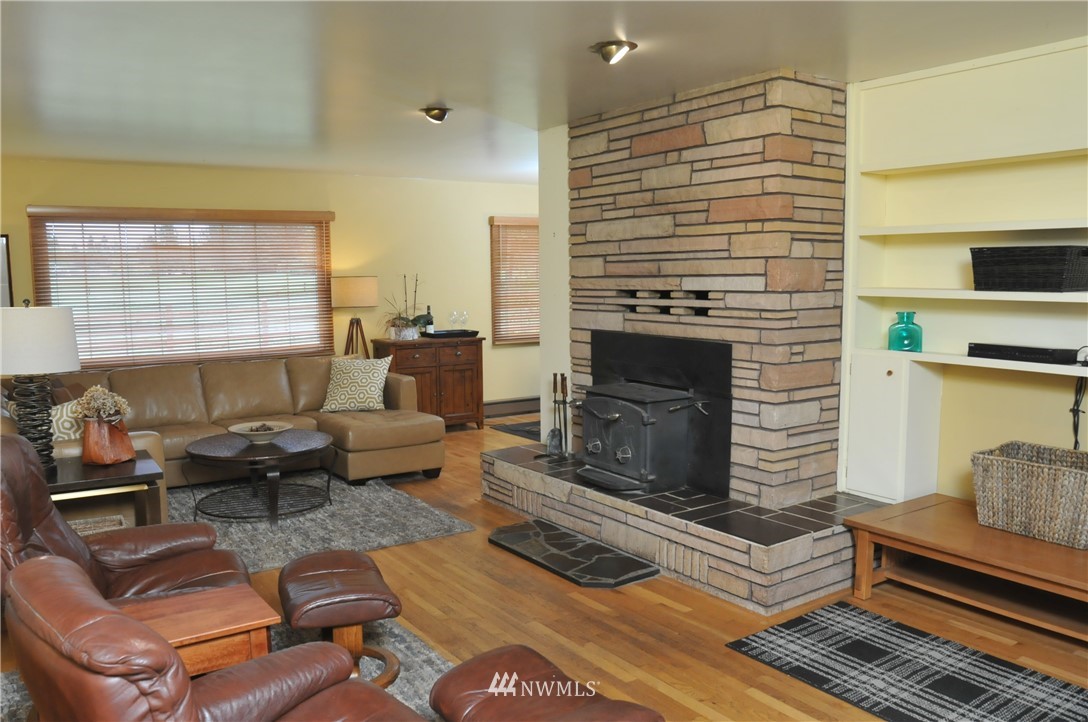 3879 Brown Road Ferndale, WA 98248 - Photo 6 of 36 a living room with furniture and a fireplace