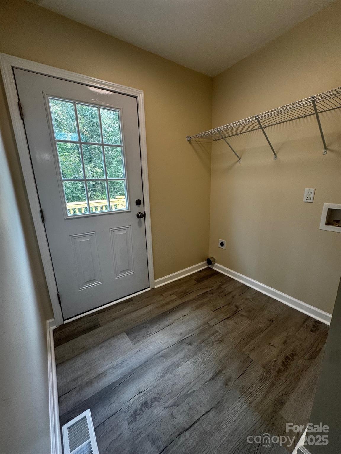 194 Providence Mill Road Maiden, NC 28650 - Photo 11 of 15 an empty room with wooden floor and windows