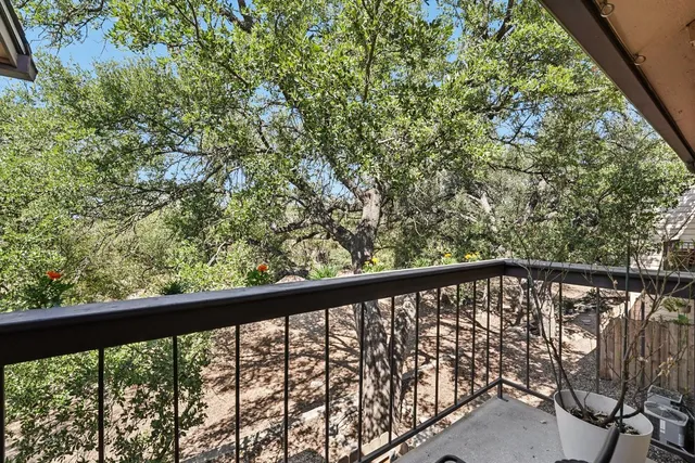 a view of balcony with furniture