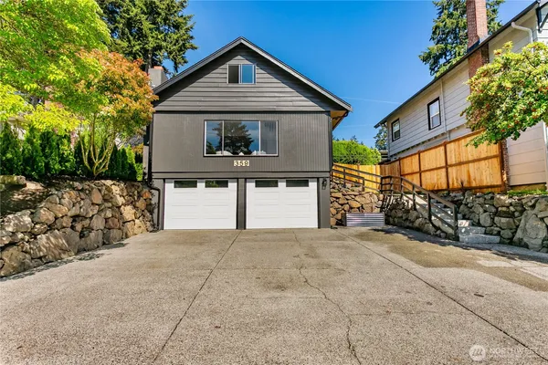 a front view of a house with a garage