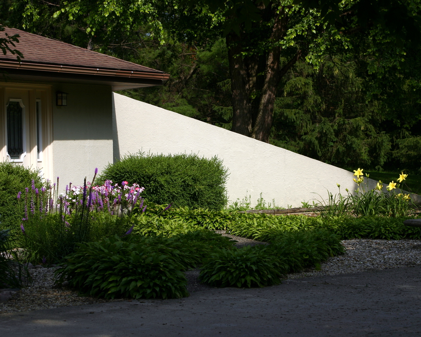 16380 Browns Road Morrison, IL 61270 - Photo 33 of 41 a view of a wooden house with a flower garden in front of it