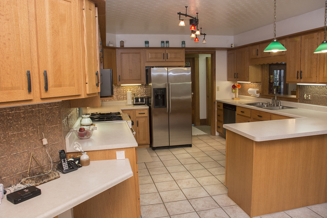 16380 Browns Road Morrison, IL 61270 - Photo 9 of 41 a kitchen with stainless steel appliances a sink stove and refrigerator