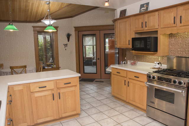 16380 Browns Road Morrison, IL 61270 - Photo 10 of 41 a kitchen with stainless steel appliances granite countertop a stove a sink and a refrigerator