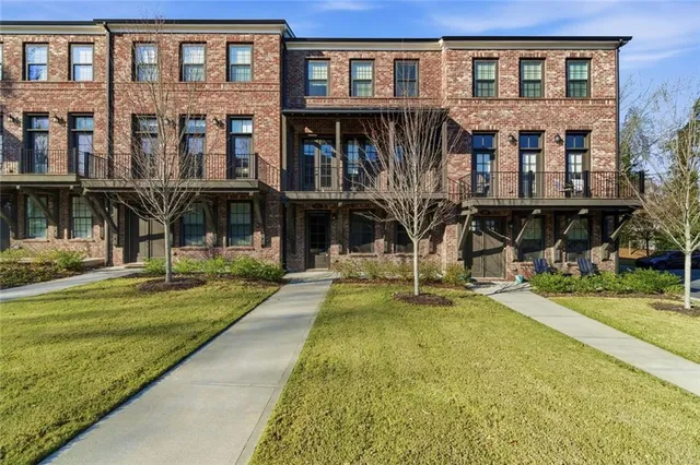 a view of a building with a yard