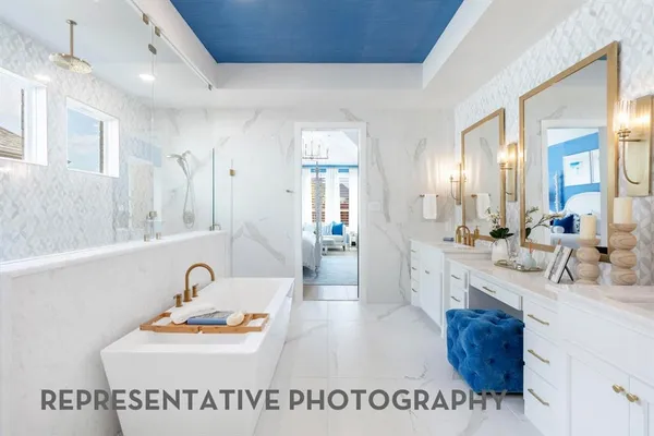 a spacious bathroom with a sink a mirror and vanity