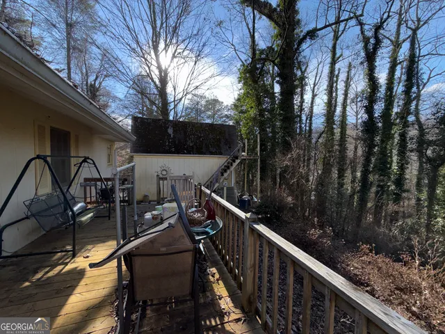 a view of a balcony with furniture