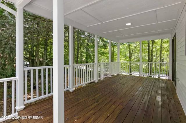 a view of balcony with wooden floor