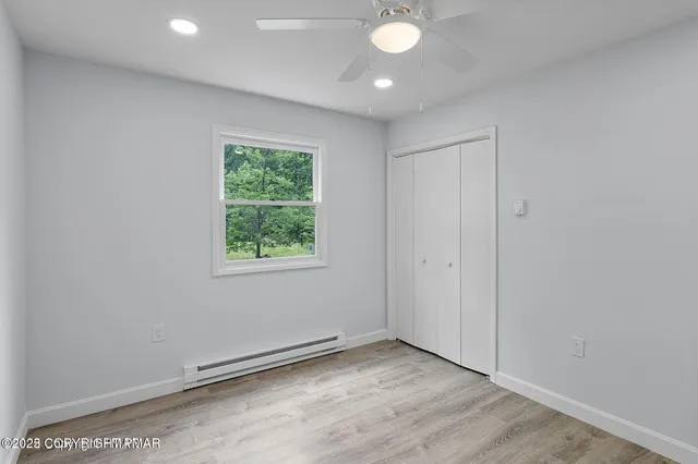 a view of an empty room with a window