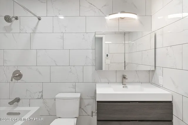 a bathroom with a sink and a shower