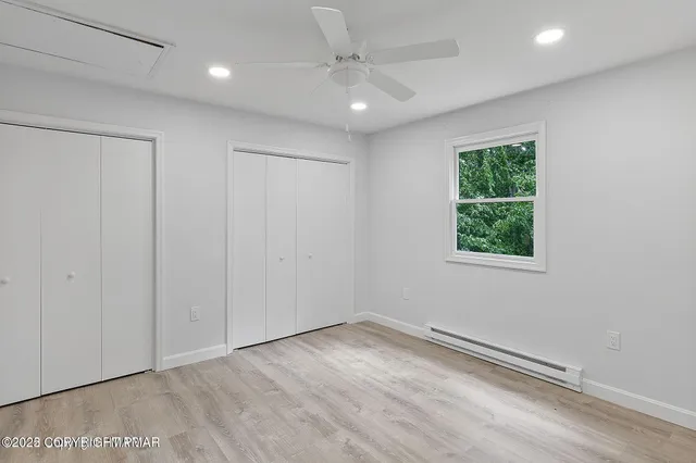 an empty room with a empty space and a window