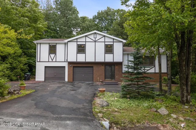 a view of front of house with a yard