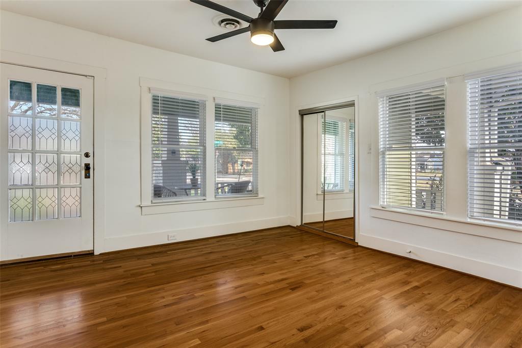 4601 Pershing Avenue Fort Worth, TX 76107 - Photo 15 of 28 a view of an empty room with a window and wooden floor
