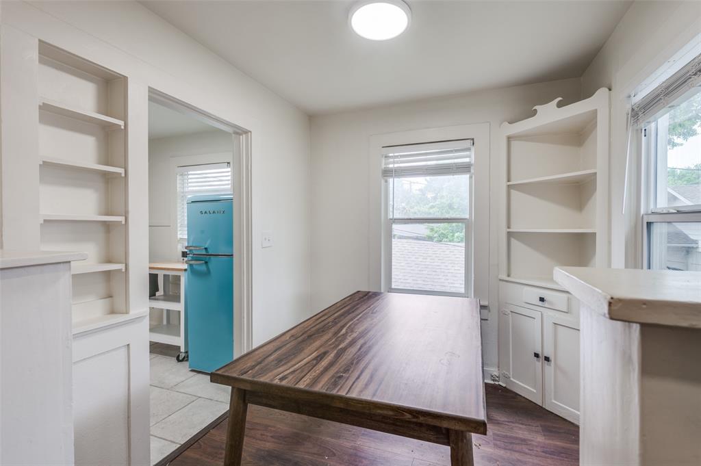 4601 Pershing Avenue Fort Worth, TX 76107 - Photo 24 of 28 a view of an empty room with a window and wooden floor