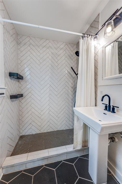 4601 Pershing Avenue Fort Worth, TX 76107 - Photo 26 of 28 a bathroom with a sink and a shower