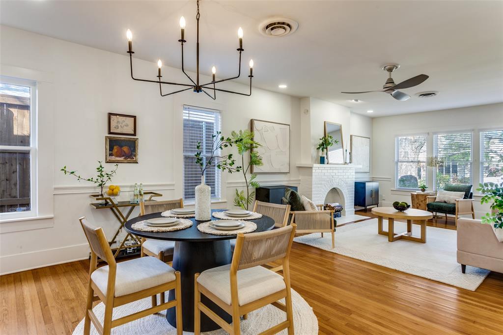 4601 Pershing Avenue Fort Worth, TX 76107 - Photo 6 of 28 a view of a dining room with furniture a chandelier and wooden floor
