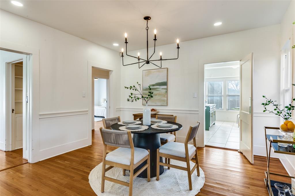 4601 Pershing Avenue Fort Worth, TX 76107 - Photo 7 of 28 a dining room with furniture a chandelier and wooden floor