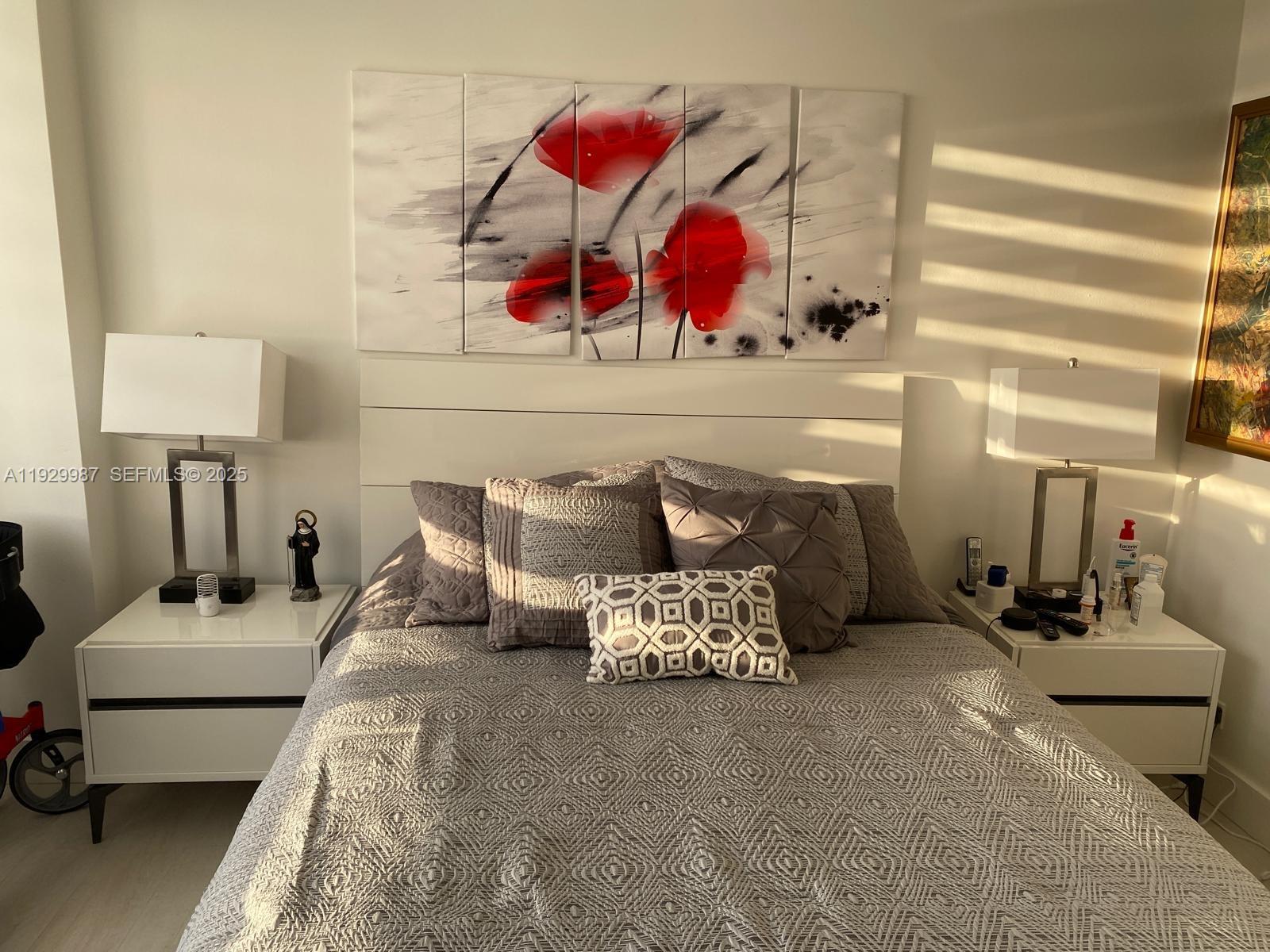 5601 Collins Avenue, Unit 622 Miami Beach, FL 33140 - Photo 8 of 15 a bedroom with furniture and a bed