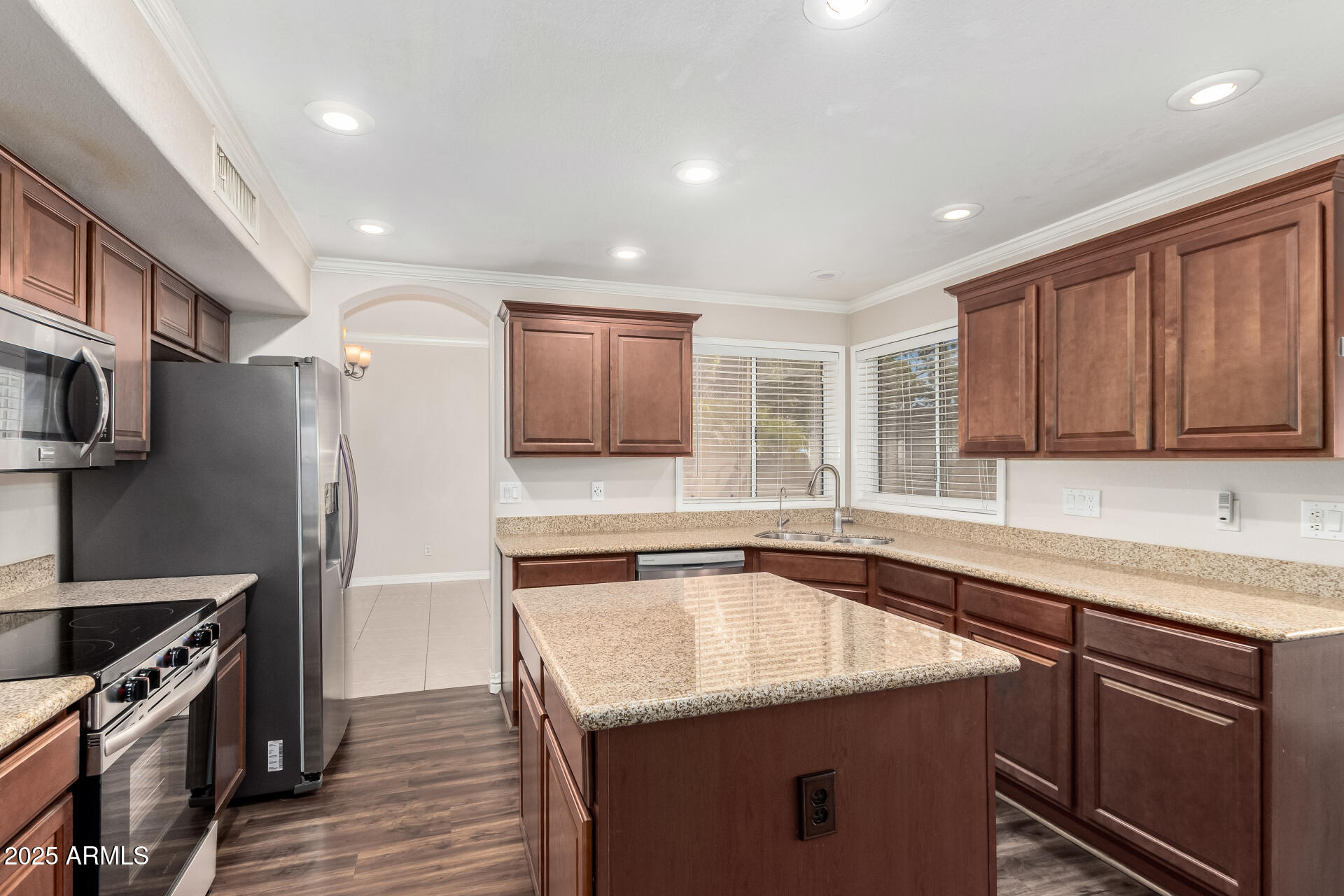 3013 East Bighorn Avenue Phoenix, AZ 85048 - Photo 11 of 40 a kitchen with stainless steel appliances granite countertop a sink stove and refrigerator
