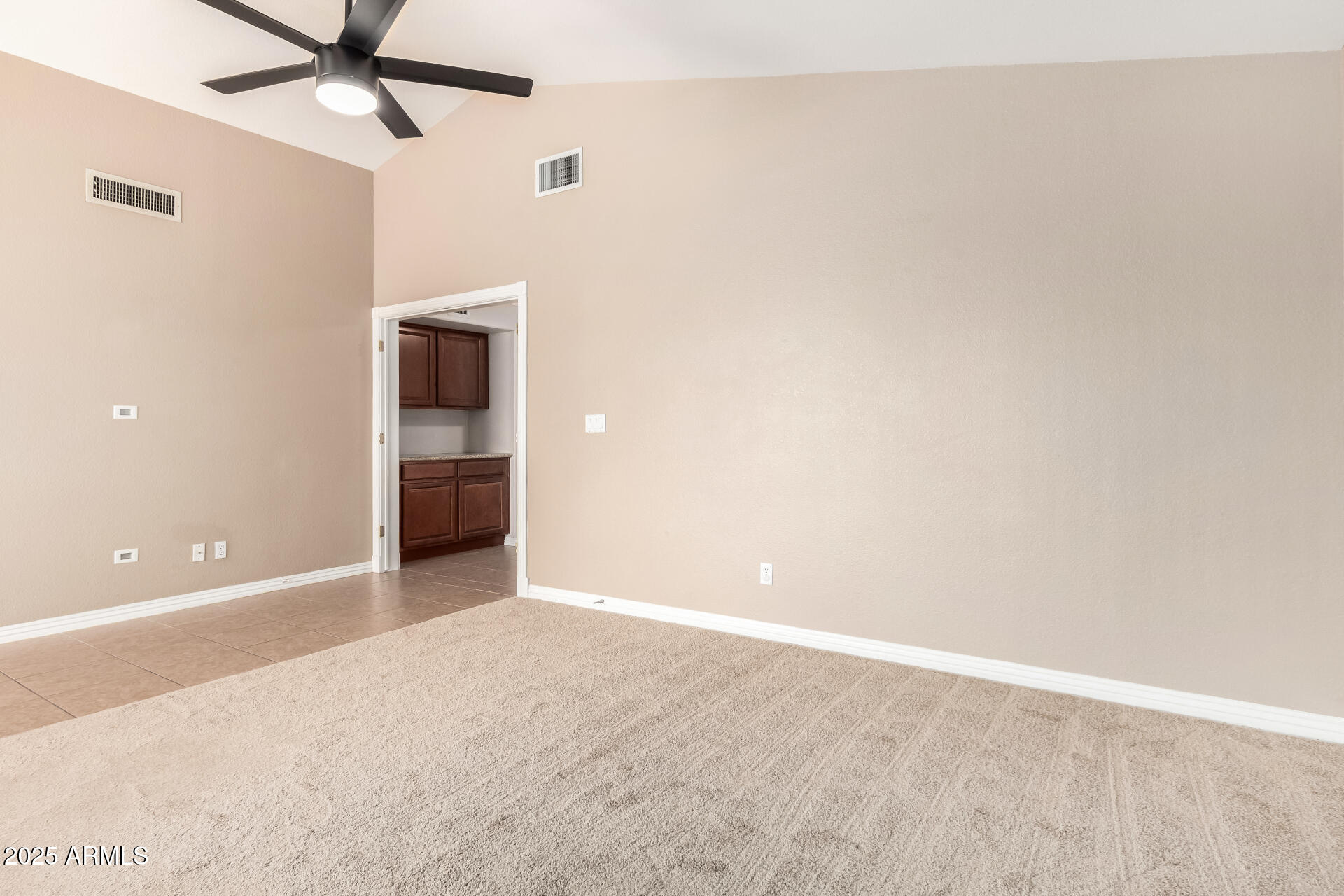 3013 East Bighorn Avenue Phoenix, AZ 85048 - Photo 14 of 40 a view of an empty room with a ceiling fan
