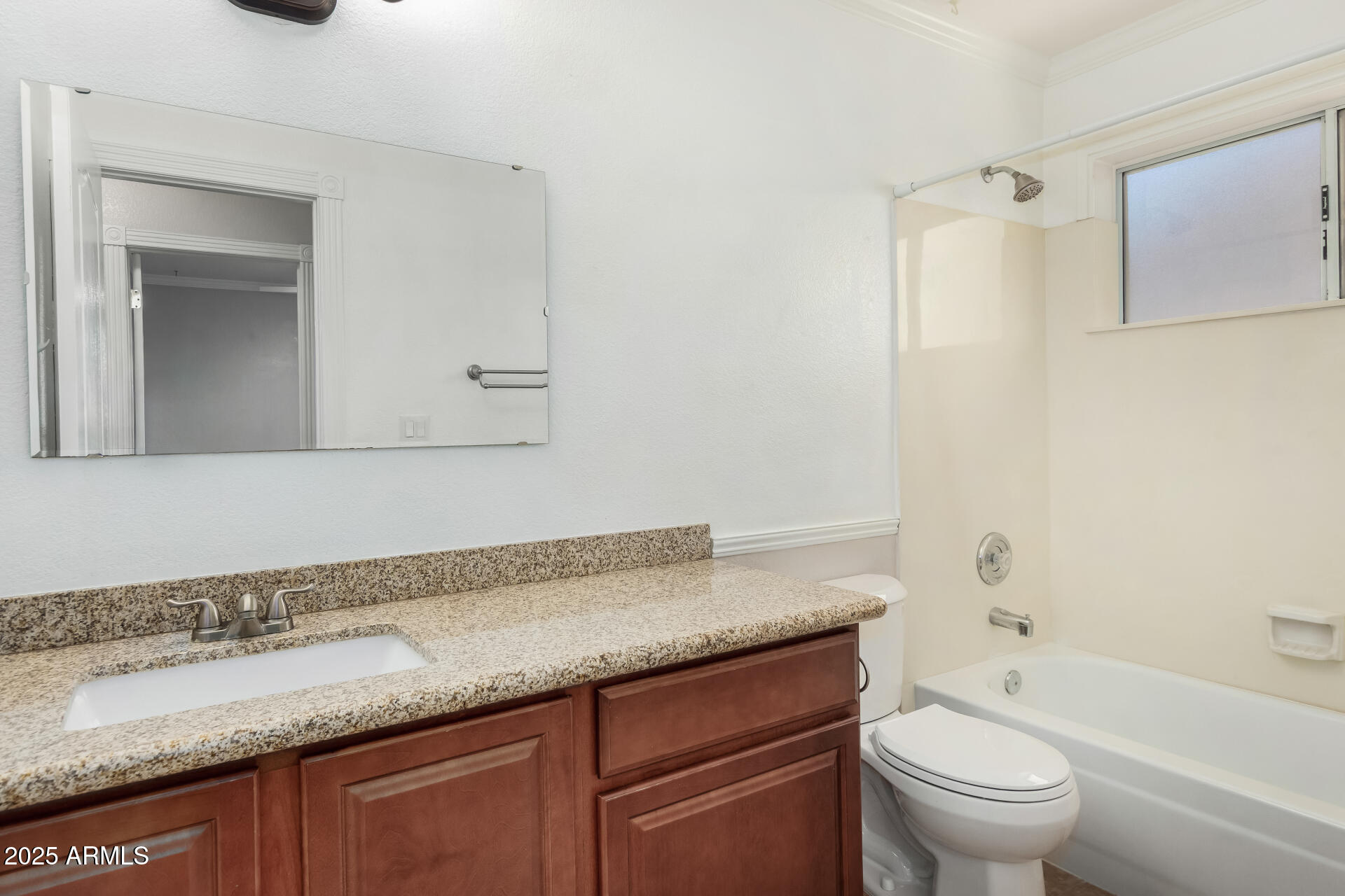 3013 East Bighorn Avenue Phoenix, AZ 85048 - Photo 24 of 40 a bathroom with a granite countertop sink a toilet and a bathtub