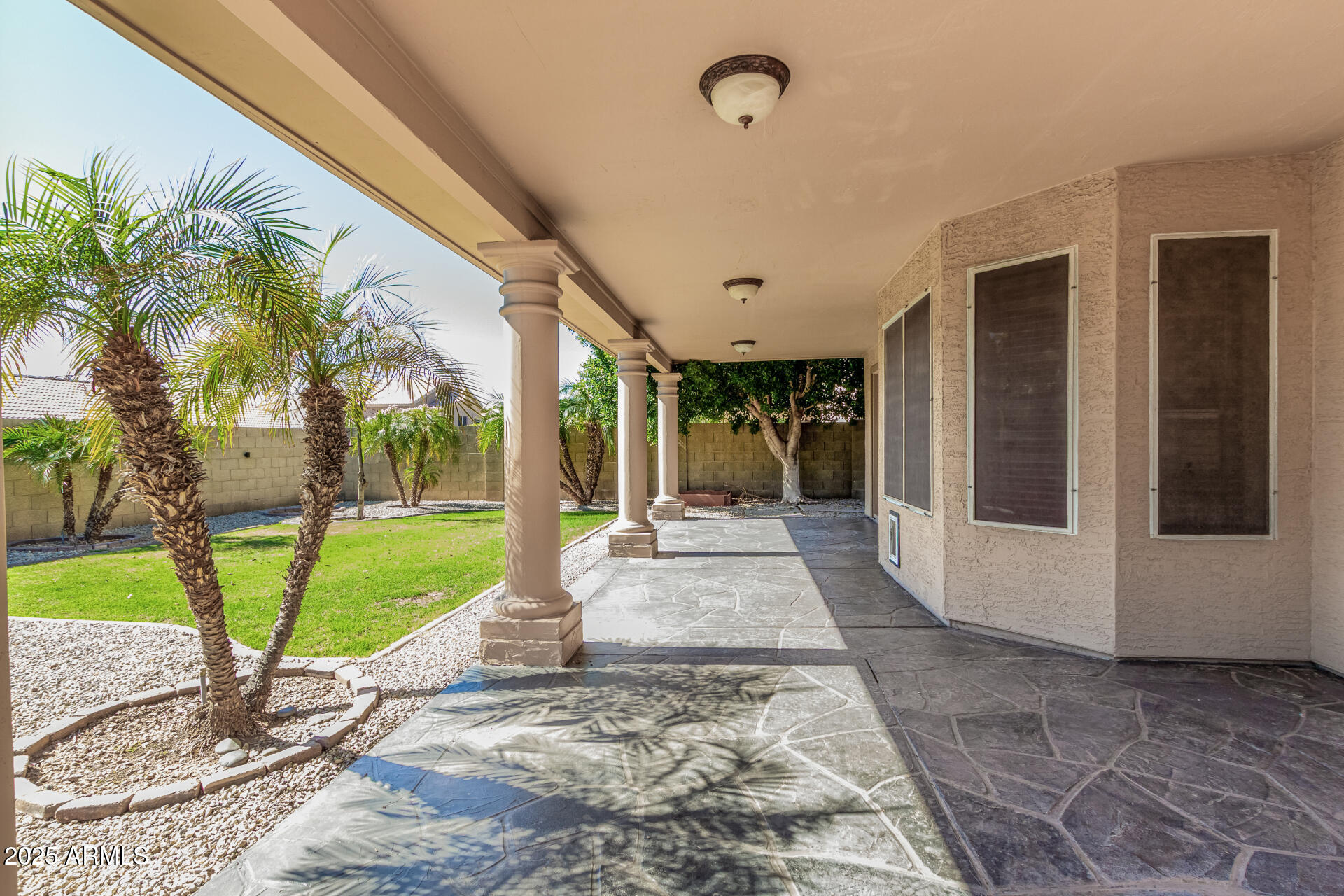 3013 East Bighorn Avenue Phoenix, AZ 85048 - Photo 34 of 40 a view of a porch with a slide table and chairs