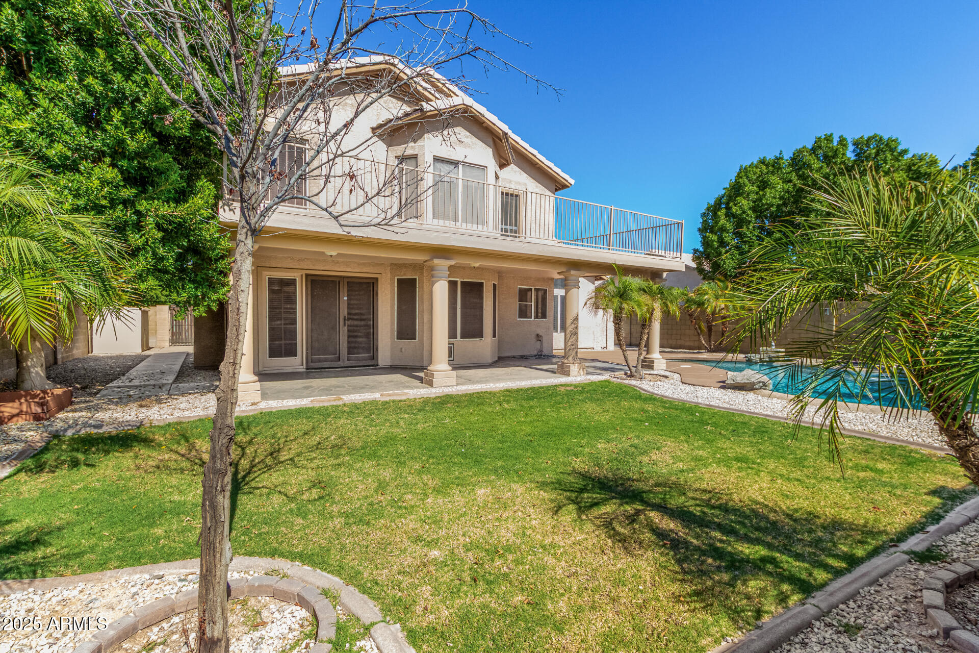 3013 East Bighorn Avenue Phoenix, AZ 85048 - Photo 38 of 40 a view of a house with a backyard and a patio