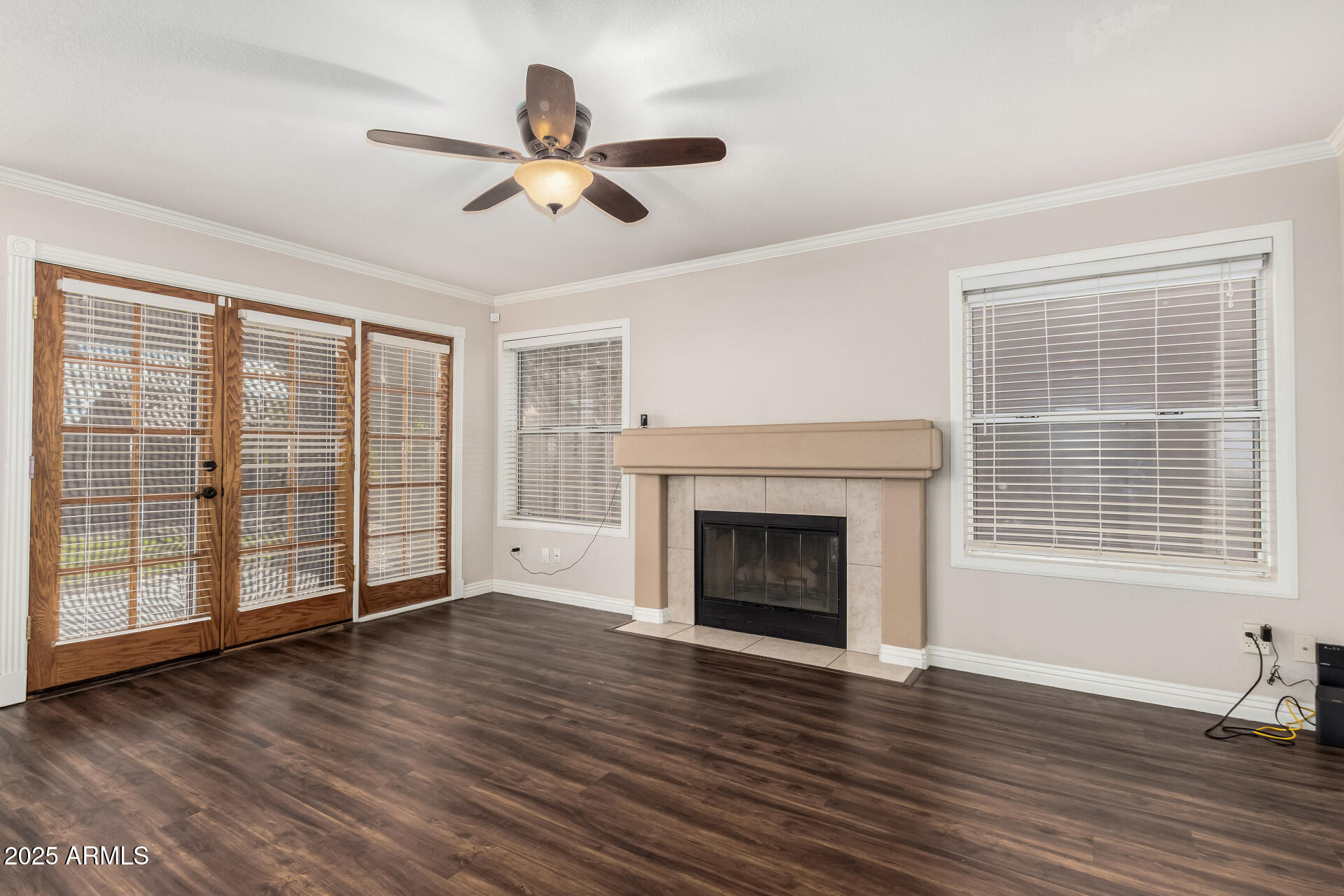3013 East Bighorn Avenue Phoenix, AZ 85048 - Photo 8 of 40 a view of an empty room with wooden floor and a window