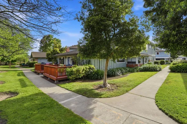 a view of a house with a yard porch and sitting area