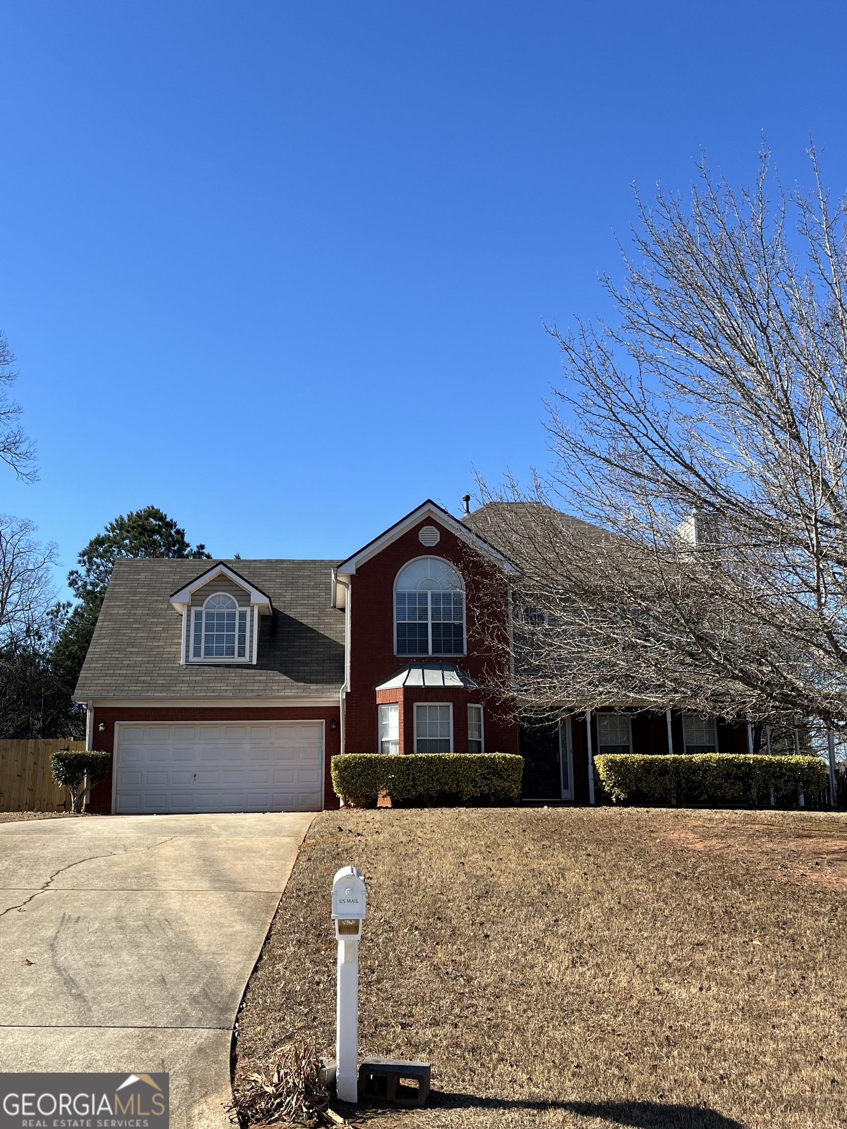 4414 Mitchells Ridge Drive Ellenwood, GA 30294 - Photo 1 of 2 a front view of a house with a yard