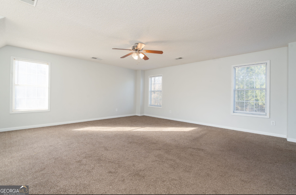 4414 Mitchells Ridge Drive Ellenwood, GA 30294 - Photo 15 of 25 a view of an empty room with a window