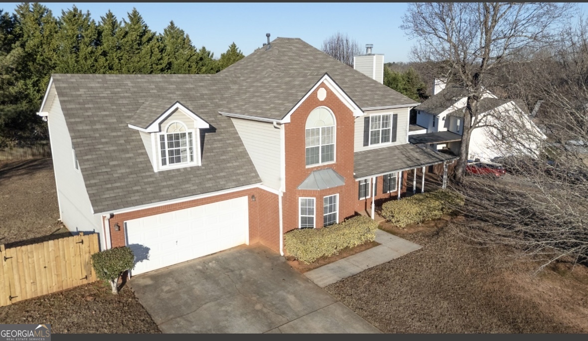 4414 Mitchells Ridge Drive Ellenwood, GA 30294 - Photo 25 of 25 a front view of a house with a yard
