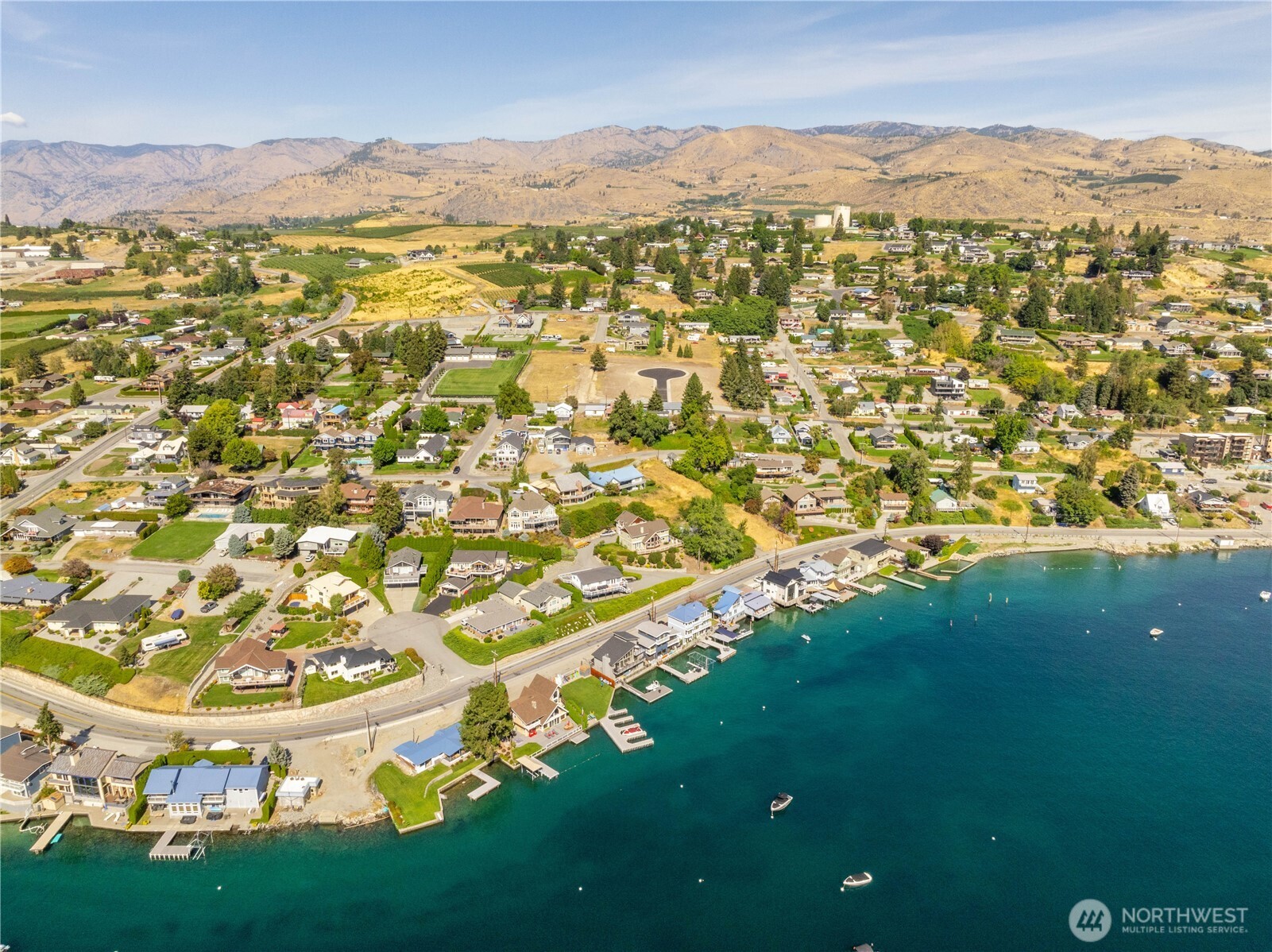 38 Indigo Lane Manson, WA 98831 - Photo 22 of 30 an aerial view of residential houses with outdoor space and trees