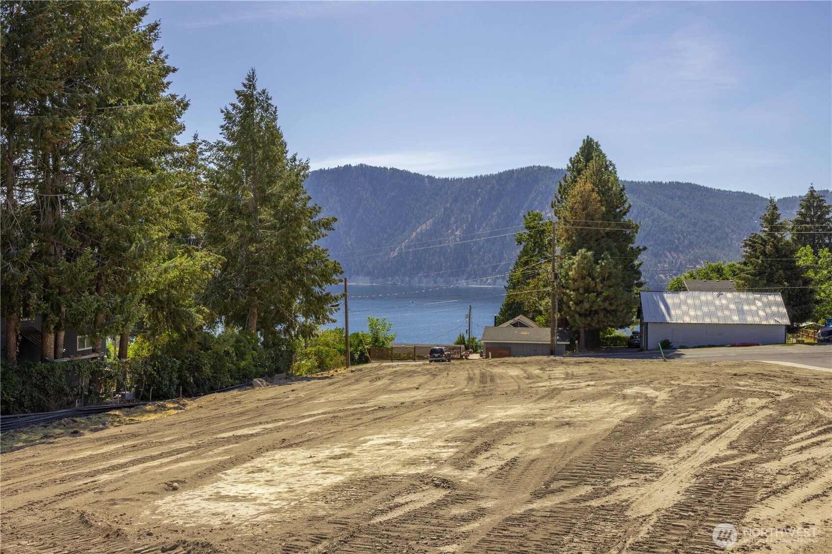 38 Indigo Lane Manson, WA 98831 - Photo 8 of 30 a view of a house with a yard and a garage