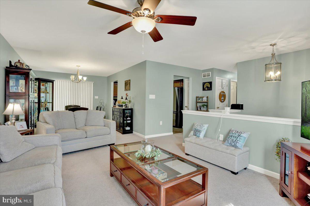 1017 Saylor Drive Temple, PA 19560 - Photo 7 of 36 a living room with furniture and a wooden floor