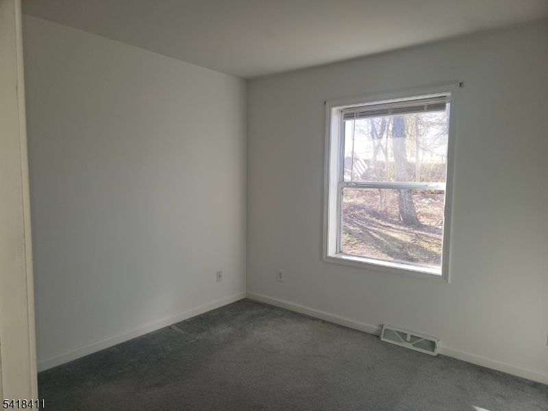 309 Wagon Wheel Road, Unit B Montague, NJ 07827 - Photo 11 of 13 an empty room with a window