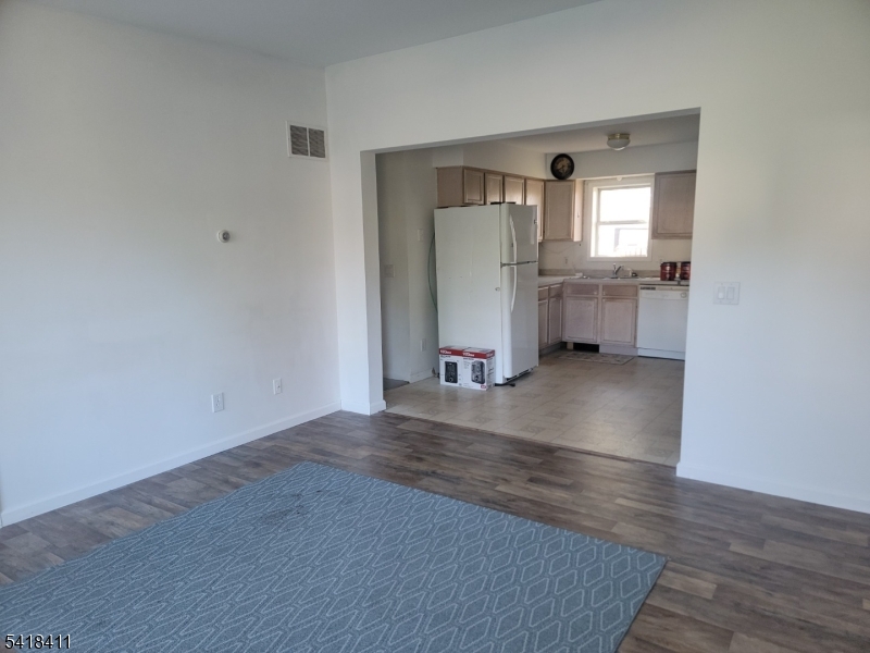 309 Wagon Wheel Road, Unit B Montague, NJ 07827 - Photo 2 of 13 a view of a room with wooden floor and a kitchen