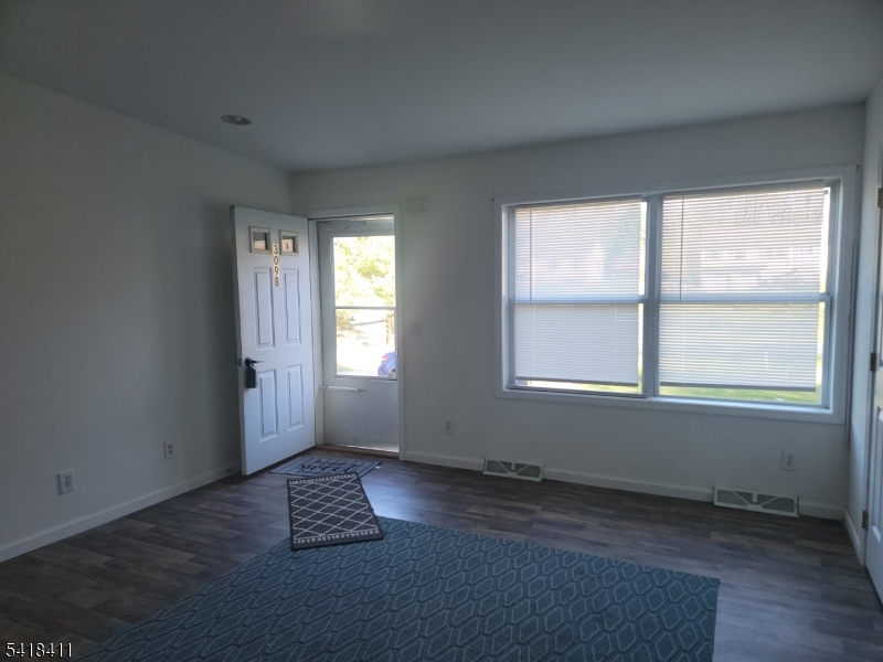 309 Wagon Wheel Road, Unit B Montague, NJ 07827 - Photo 3 of 13 an empty room with windows