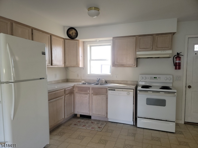 309 Wagon Wheel Road, Unit B Montague, NJ 07827 - Photo 4 of 13 a kitchen with a stove sink and refrigerator