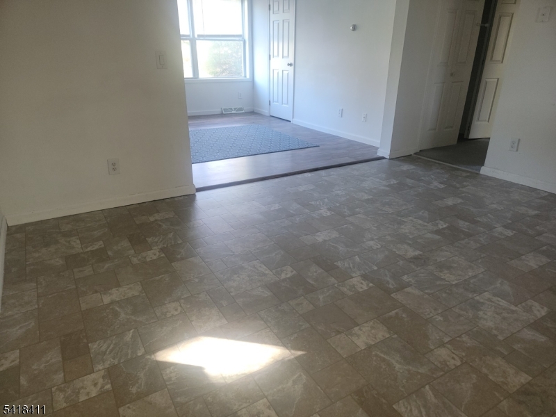309 Wagon Wheel Road, Unit B Montague, NJ 07827 - Photo 7 of 13 an empty room with windows