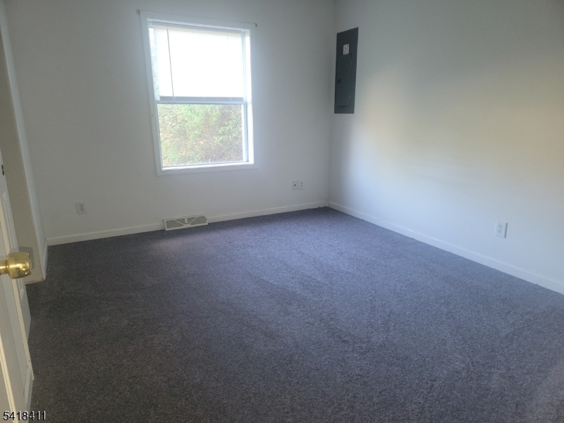 309 Wagon Wheel Road, Unit B Montague, NJ 07827 - Photo 10 of 13 an empty room with a window