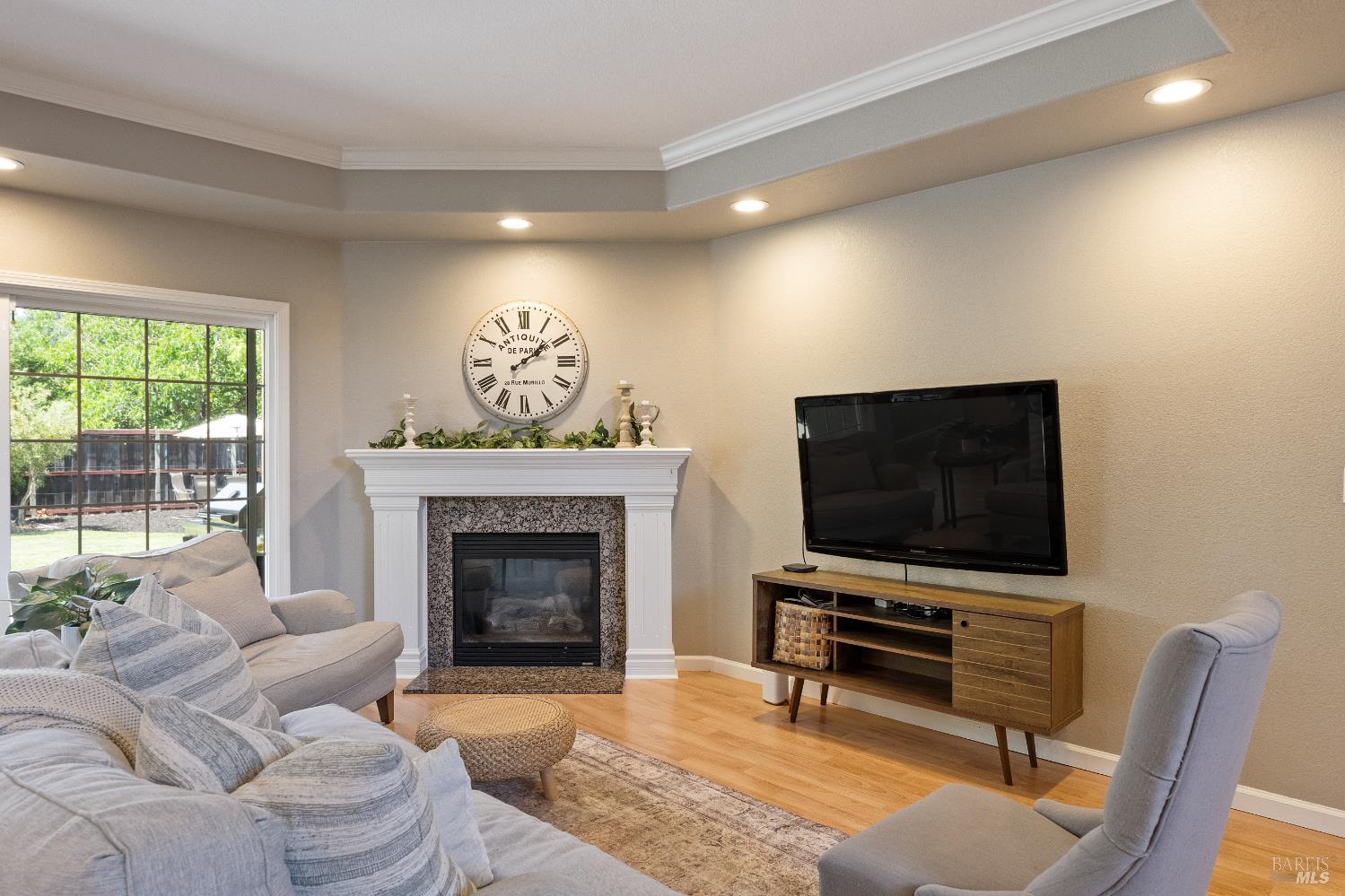 1238 Darling Street Napa, CA 94558 - Photo 15 of 68 a living room with furniture a fireplace and a flat screen tv