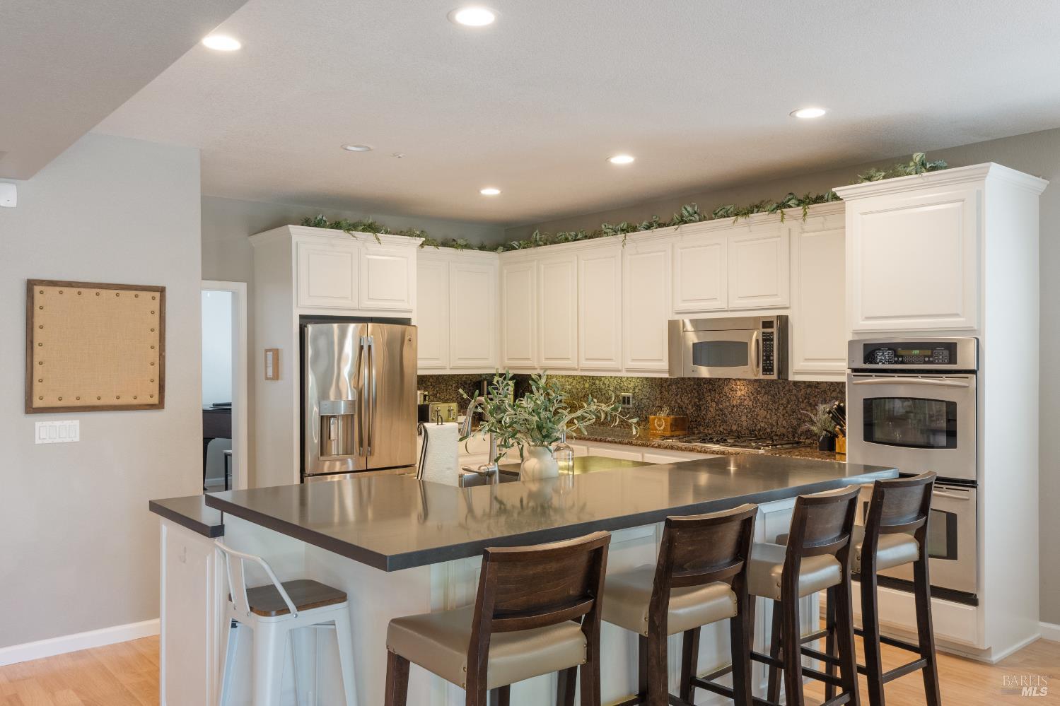 1238 Darling Street Napa, CA 94558 - Photo 16 of 68 a kitchen with stainless steel appliances a dining table chairs and refrigerator