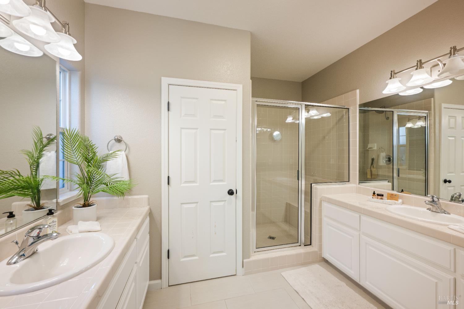 1238 Darling Street Napa, CA 94558 - Photo 27 of 68 a bathroom with a double vanity sink and shower